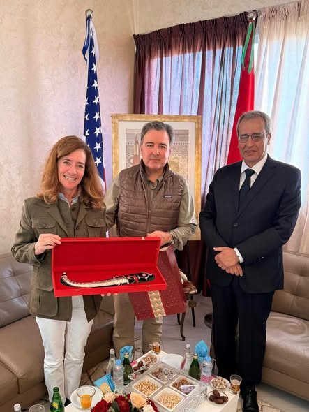 Ambassador Duke Buchan III receiving a traditional Moroccan Kumya from Wali Ali Khalil